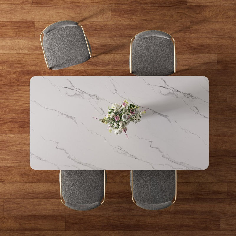 upper view of 4-seater dining table with marble tabletop and comfortable chairs