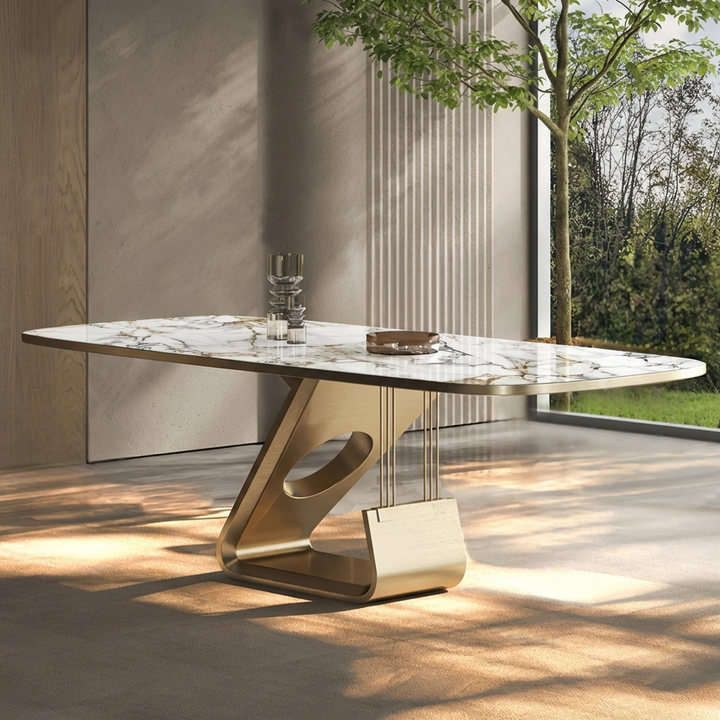 Luxury 6-seater dining table with marble top and gold base in an outdoor setting