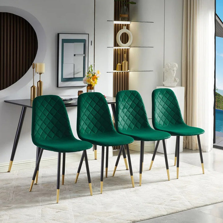 4 modern dining chairs in green with black and gold legs  