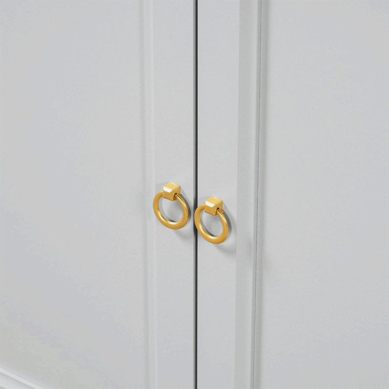 golden handles of a grey-finish sideboard