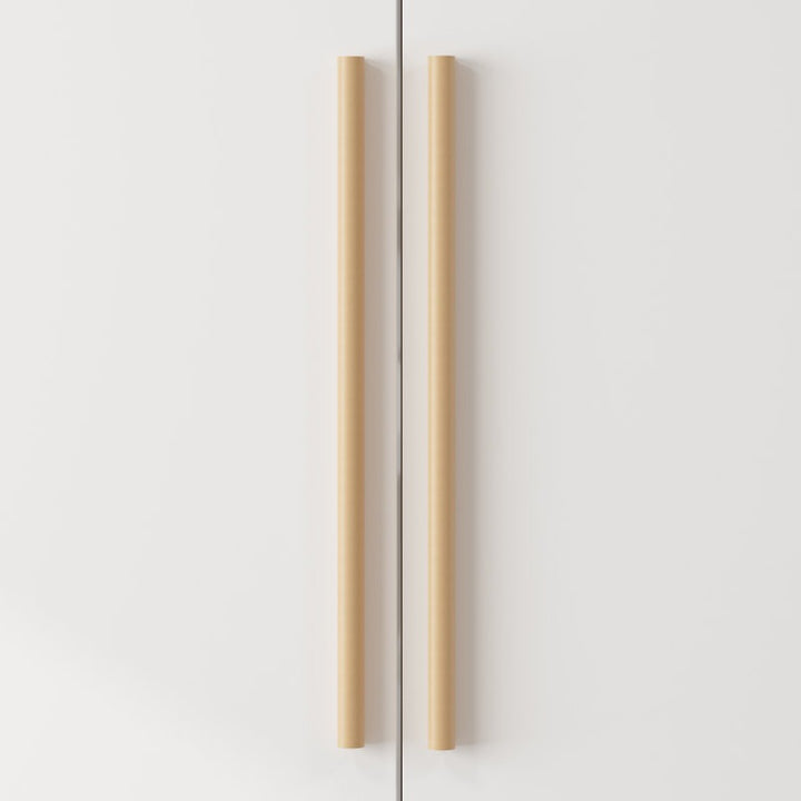 Elegant wooden handles of white 3-door wardrobe