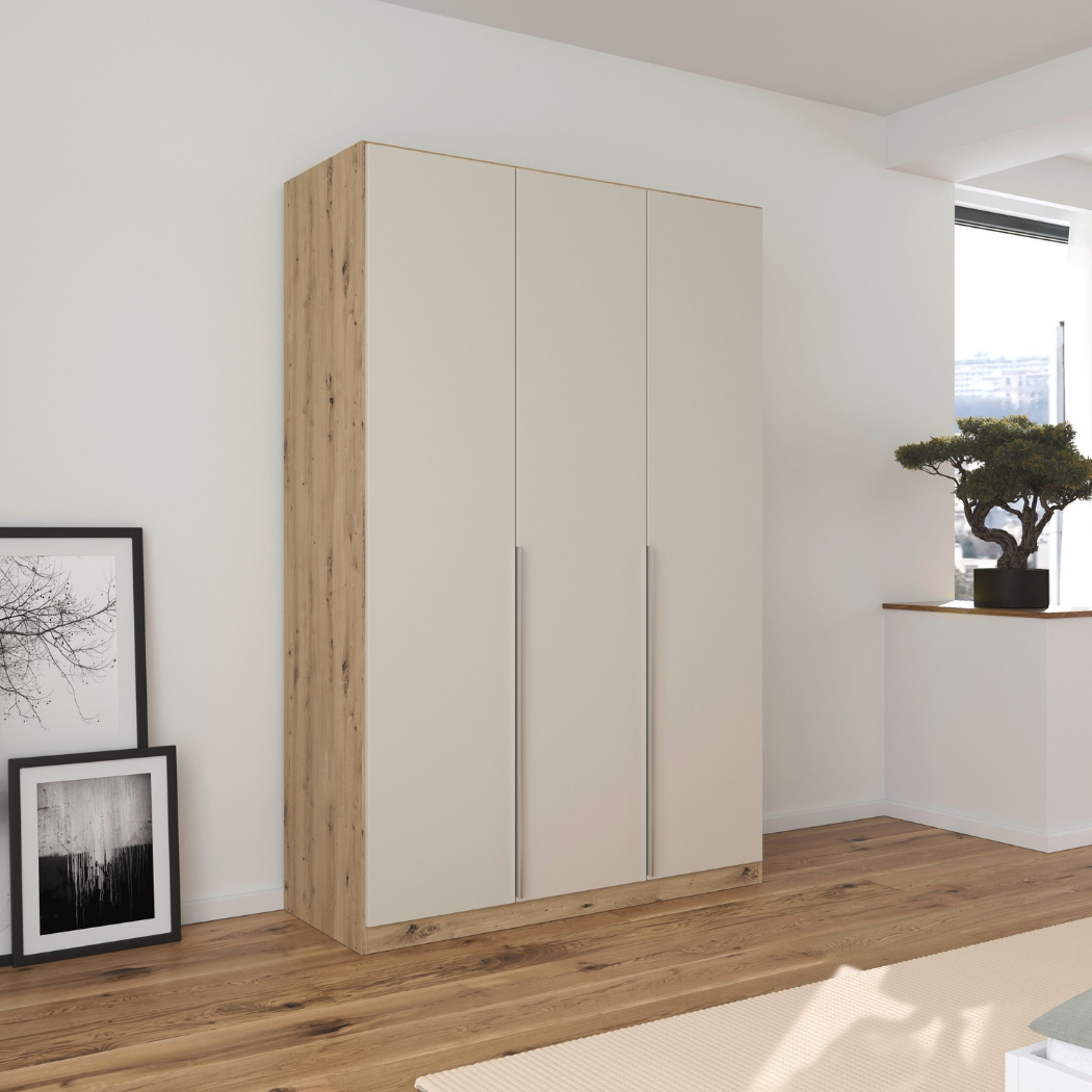 A sleek 3-door wardrobe in Beech/Beige finish with integrated handles, six shelves, and two hanging rods inside, placed in a room with minimal decor.