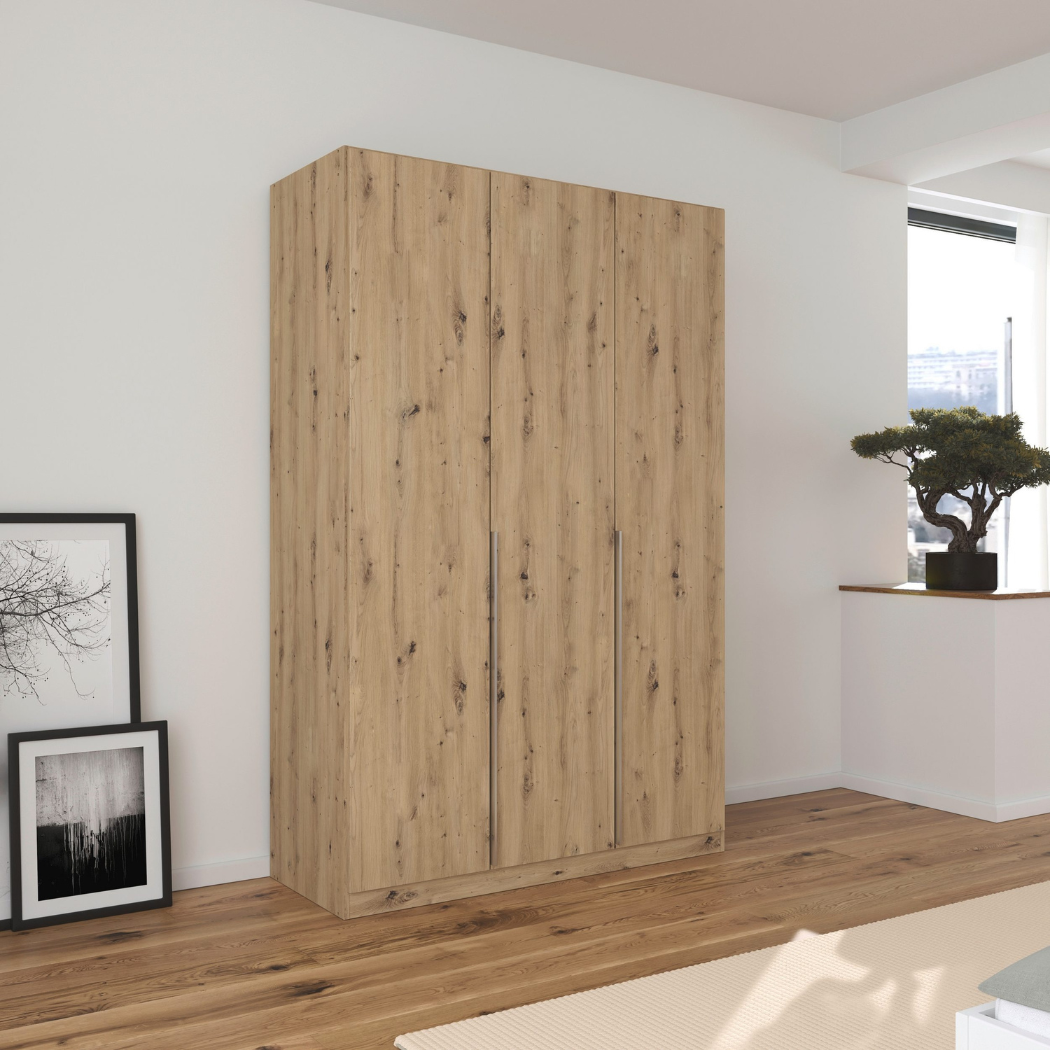 A three-door wardrobe in a beech wood finish with sleek handles and a modern design, placed in a room with minimal decor.