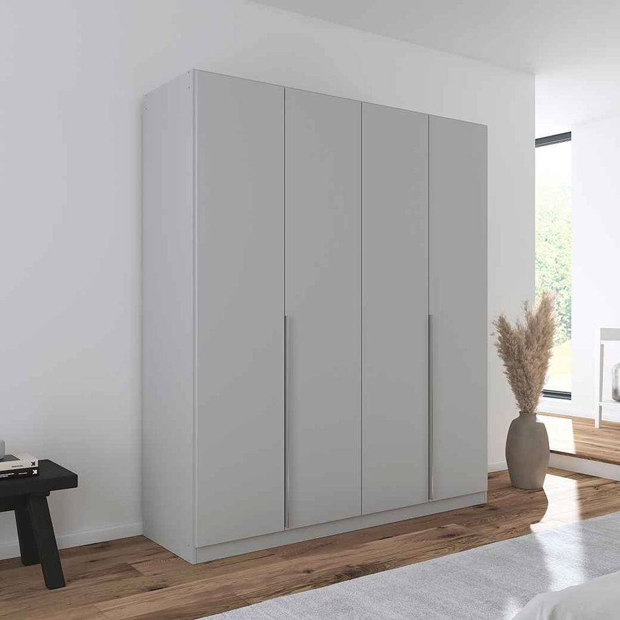 A modern grey glossy 4-door wardrobe with a sleek handle-less design, placed in a bedroom setting with minimalistic decor.