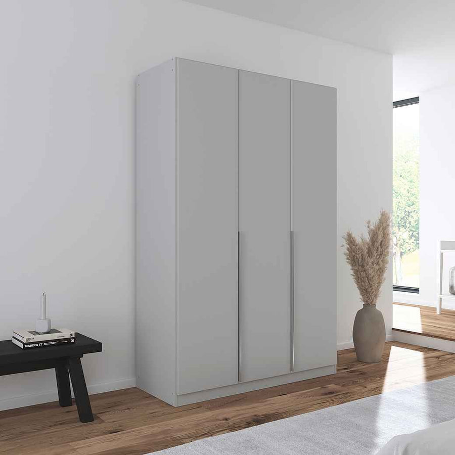 A sleek grey 3-door wardrobe with handle-less design, featured in a modern room setting with minimalistic decor.