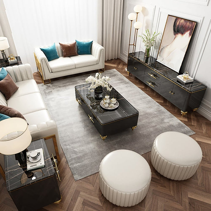 A sleek black tv unit in a living room with a marble-top rectangular center table and white sofa to make living space luxury.