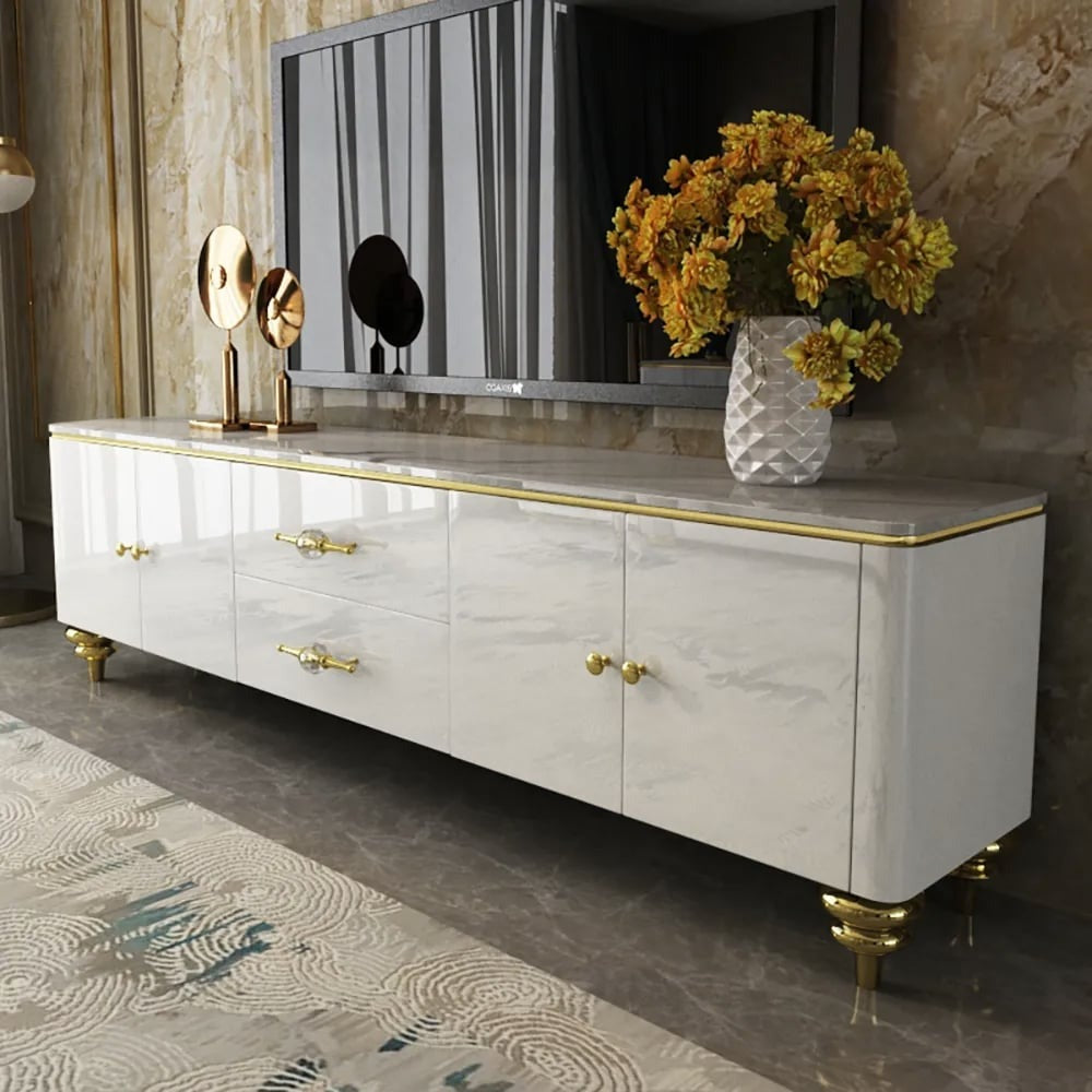 Luxury white TV stand design with gold-finish handles and legs, featuring a faux marble top, with storage drawers and doors.