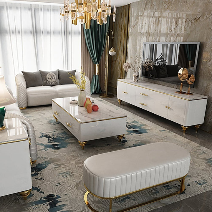 modern white marble top tv unit in living room with white elegant sofa and white rectangular marble top table
