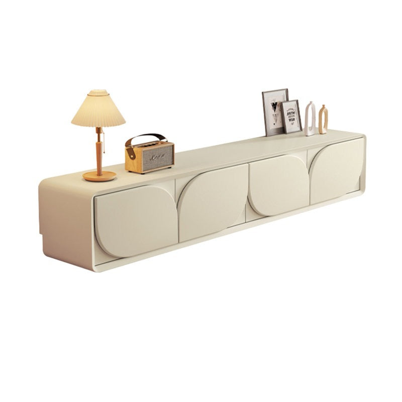 Luxury white TV unit with lamp and decorative items on top.