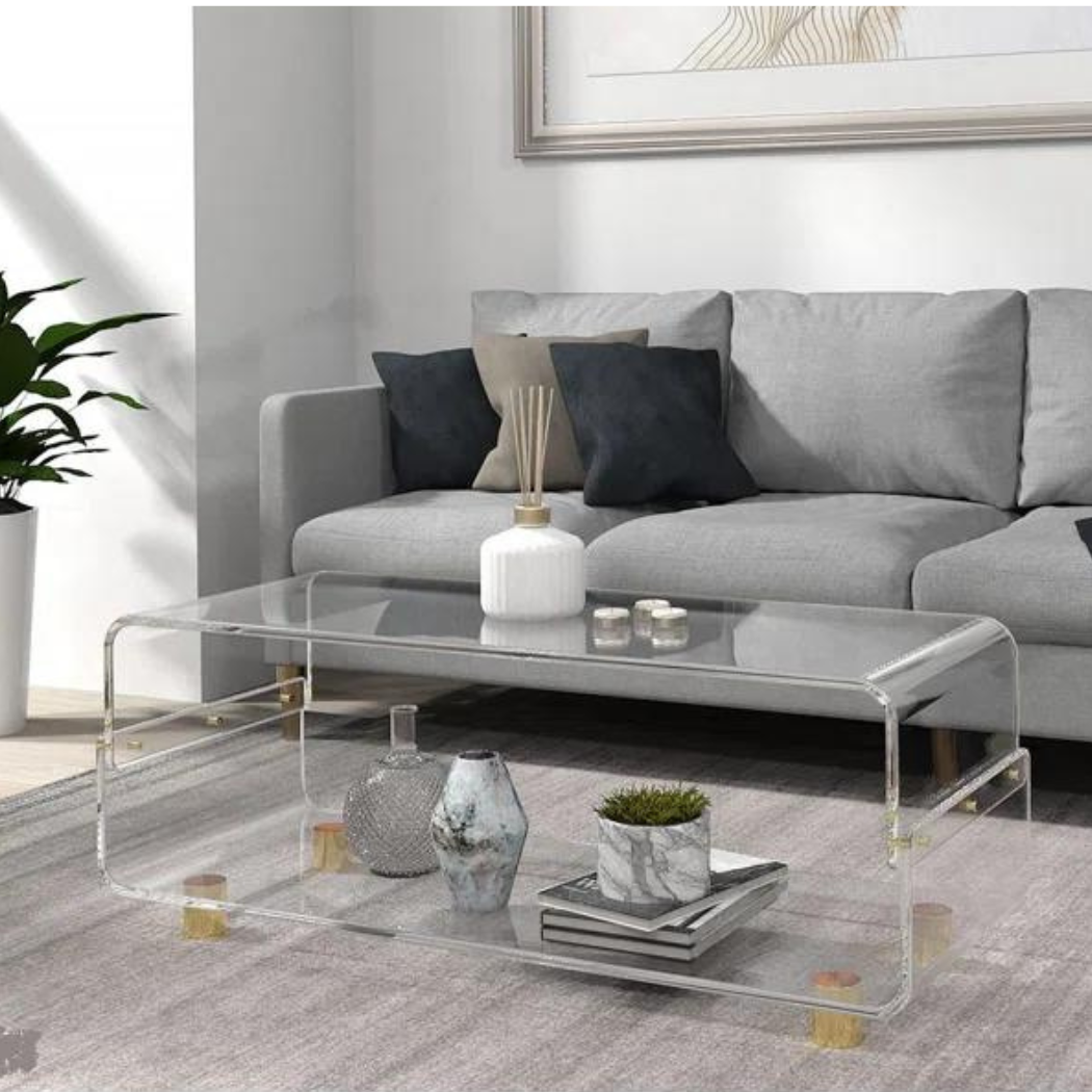 Transparent center table with grey sofa