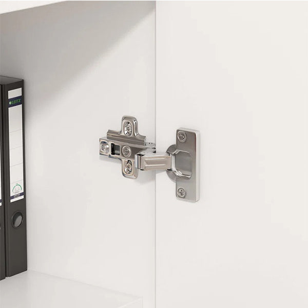 Durable metal hinge inside Brians white sideboard cabinet