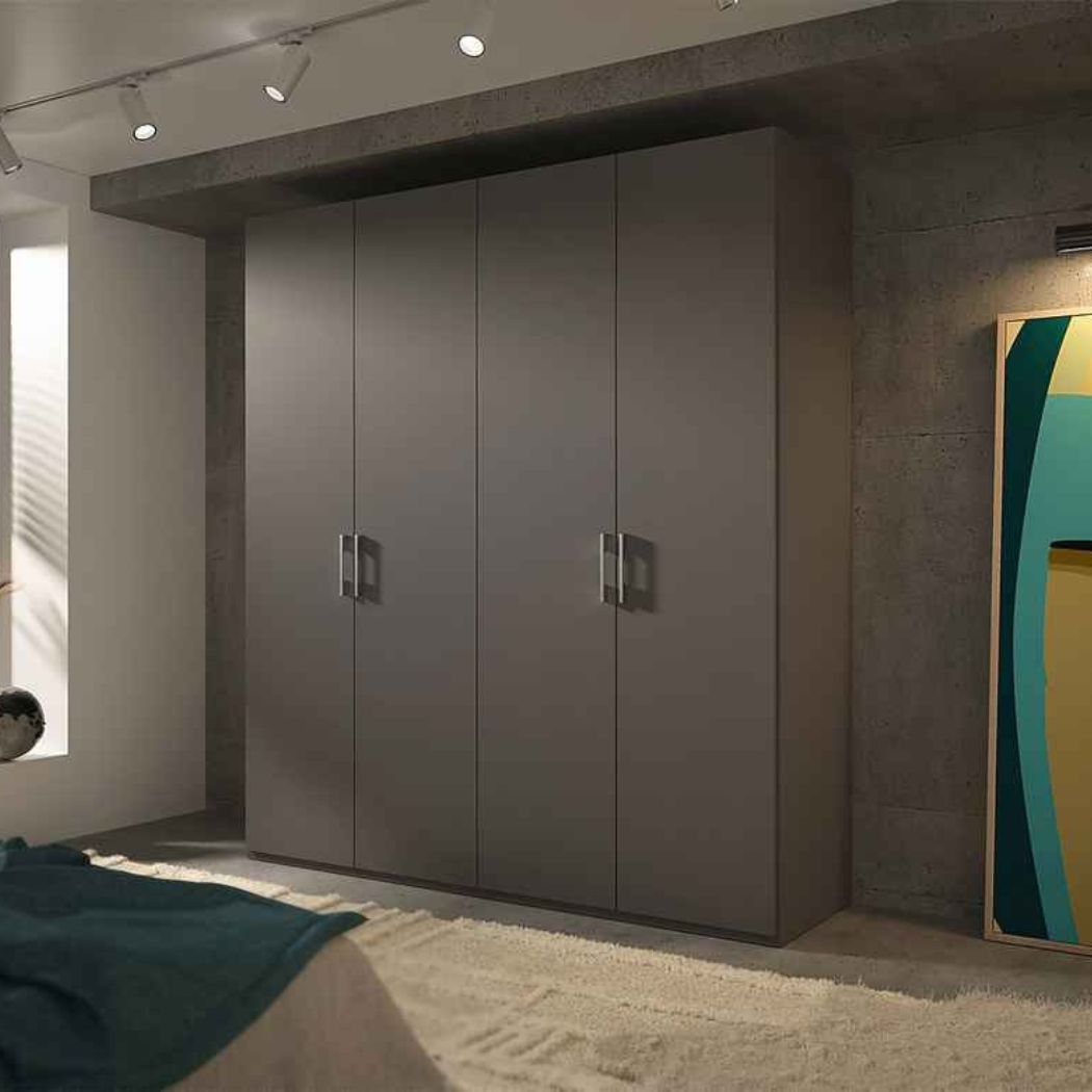 A matte black 4-door wardrobe with closed doors, featuring matte silver handles, set against a contemporary interior background.