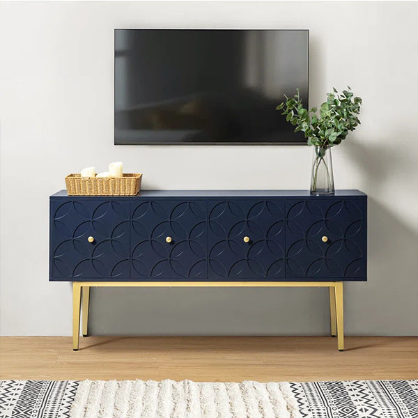 A modern navy blue sideboard cabinet with gold accent legs placed in a modern living room
