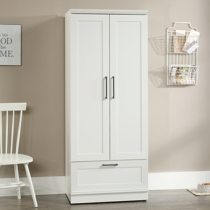 Premium white 2-door wardrobe with a chair and decorative elements in a room.