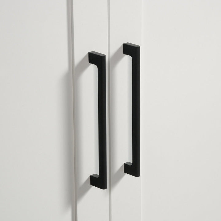 Black cabinet handles on a white cabinet door
