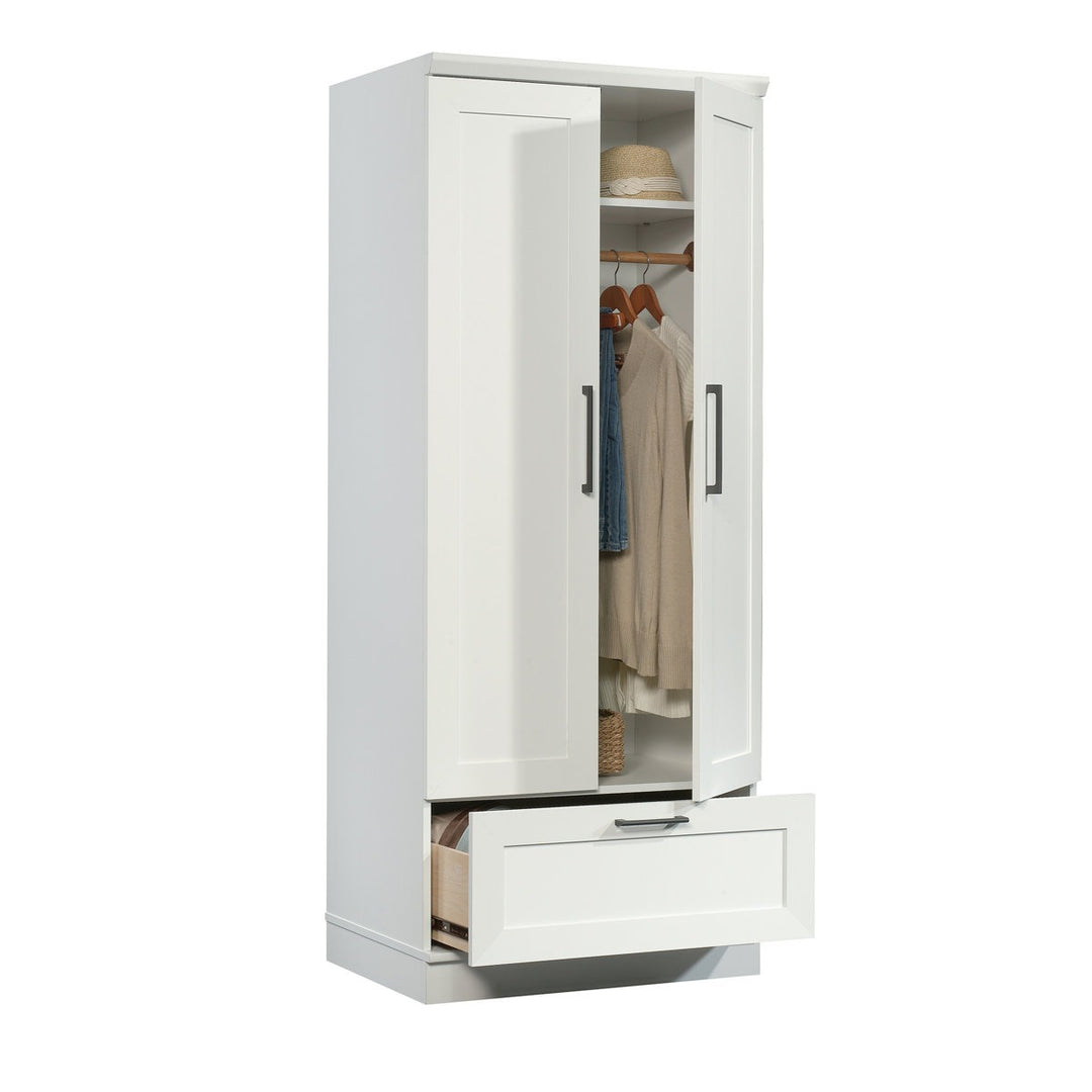 Modern white wardrobe design with open door showing clothes and a drawer on a white background