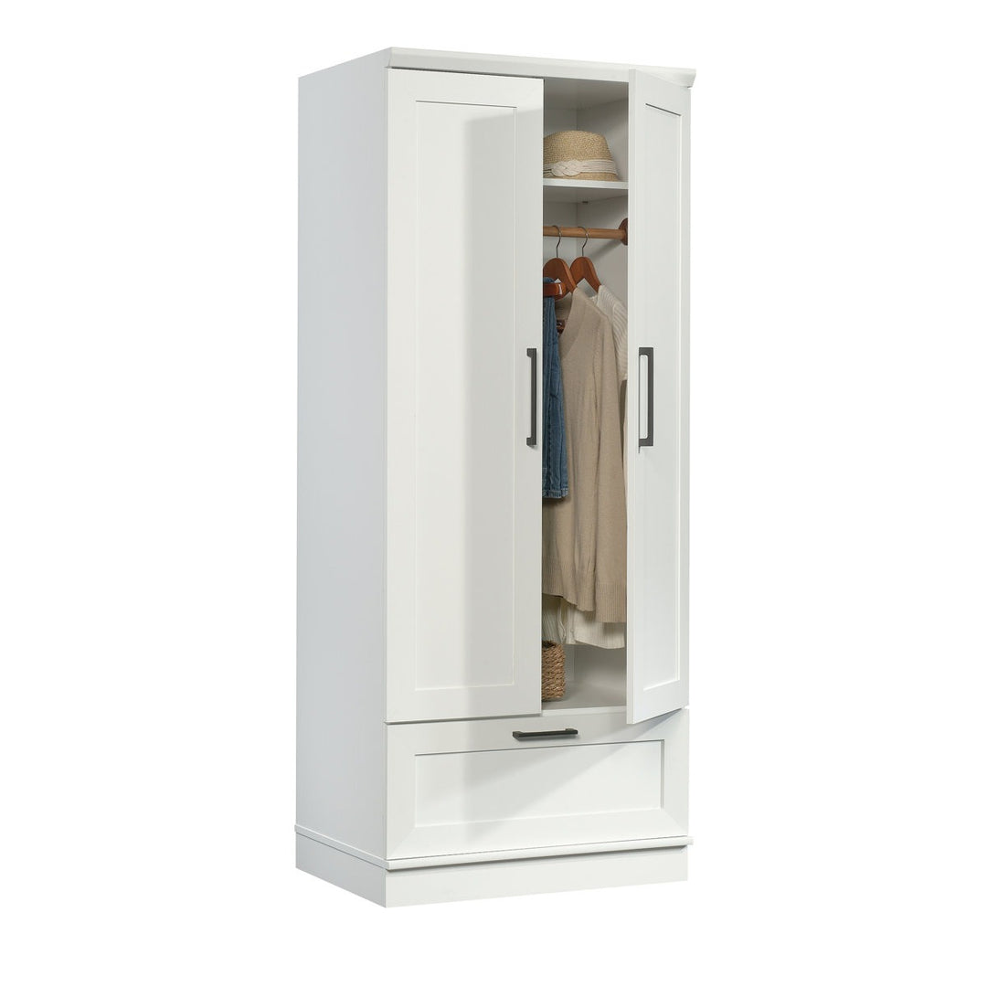 White wardrobe with open door showing clothes on a white background