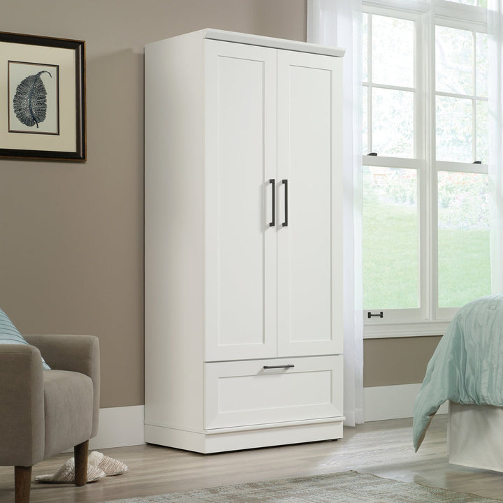 White 2-door wardrobe in a room with a window and furniture. Customization is available