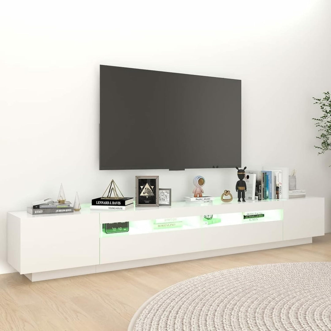 Modern white TV stand with LED lighting and metallic legs, featuring push-to-open shutters and ambient LED-lit shelving.