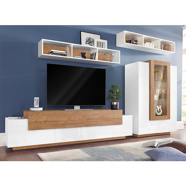 A white and beach-color-themed TV unit set with multiple shelves and drawers, featuring a flat-screen TV, placed in a living room setting.