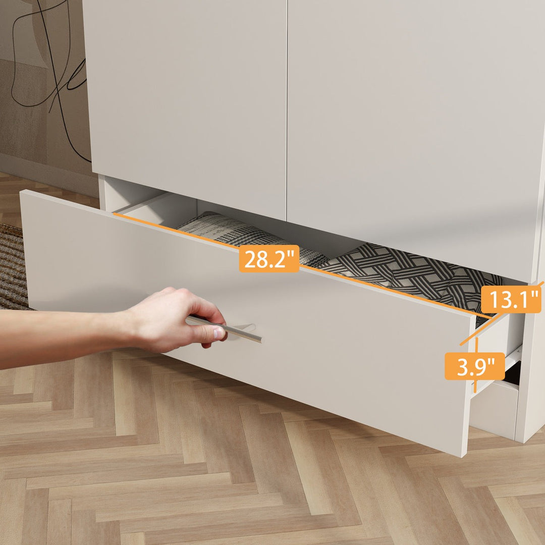 Hand opening a drawer with measurements indicated, on a wooden floor.