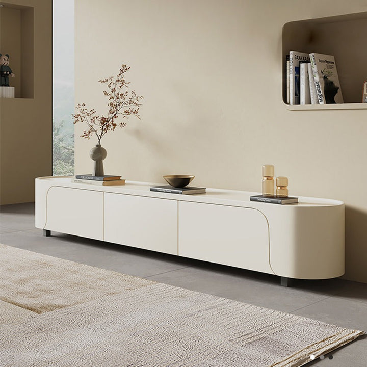 The premium TV Stand features a cream white finish, ample storage, and curved edges