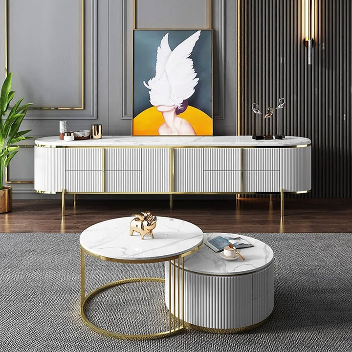 A stylish white tv stand with gold legs and handles and a marble top looks luxury storage in a living