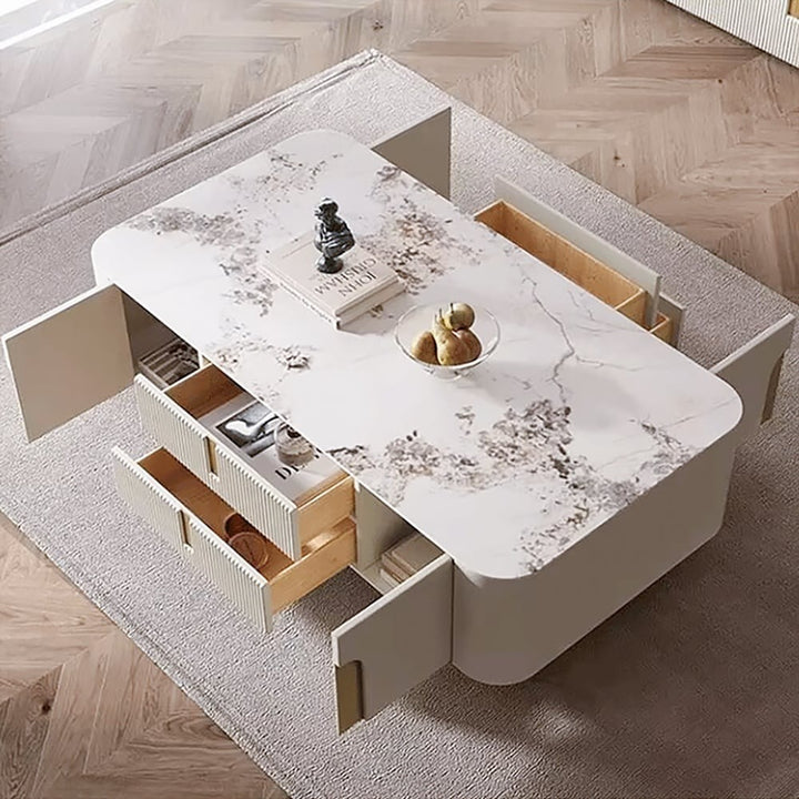 Vista beige coffee table with open storage drawer, showing spacious compartment for books, magazines, and living room essentials.