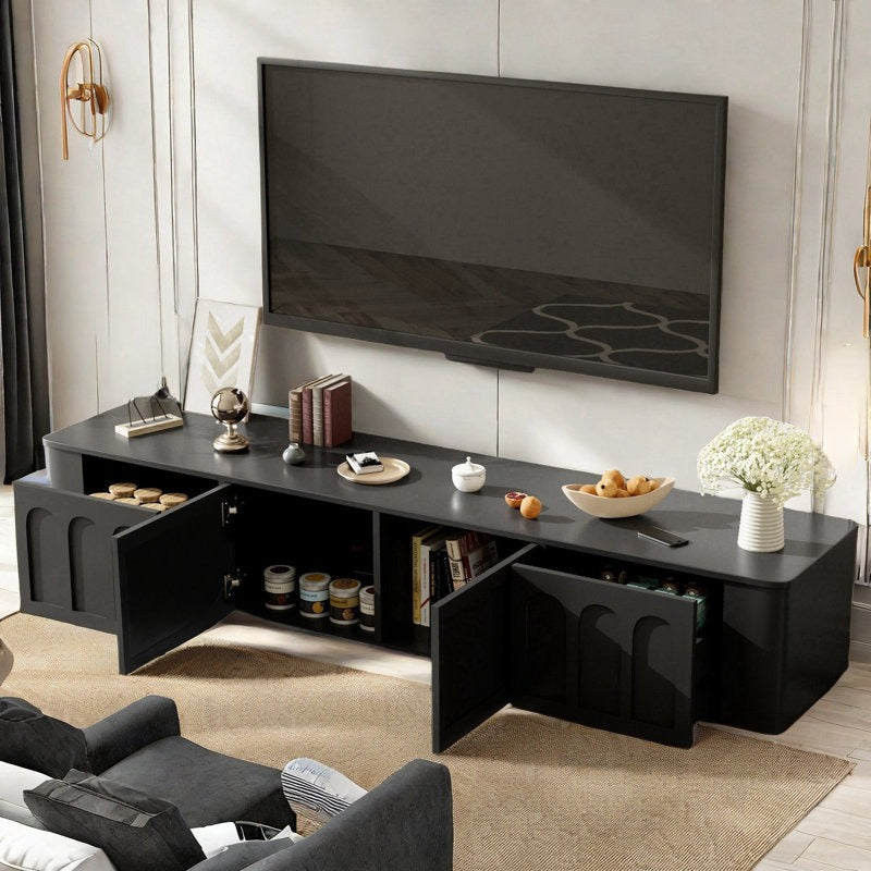 Luxury black tv unit with open drawers and doors to show internal storage