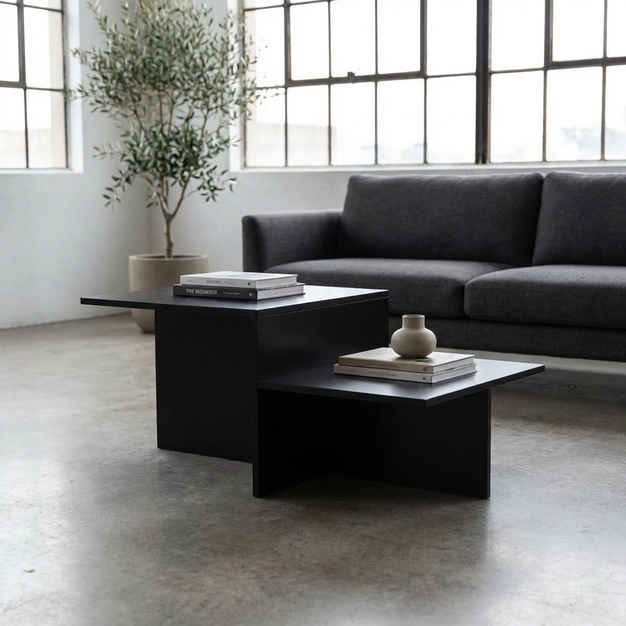 Modern living room with a dark gray sectional sofa and a black modern coffee table.
