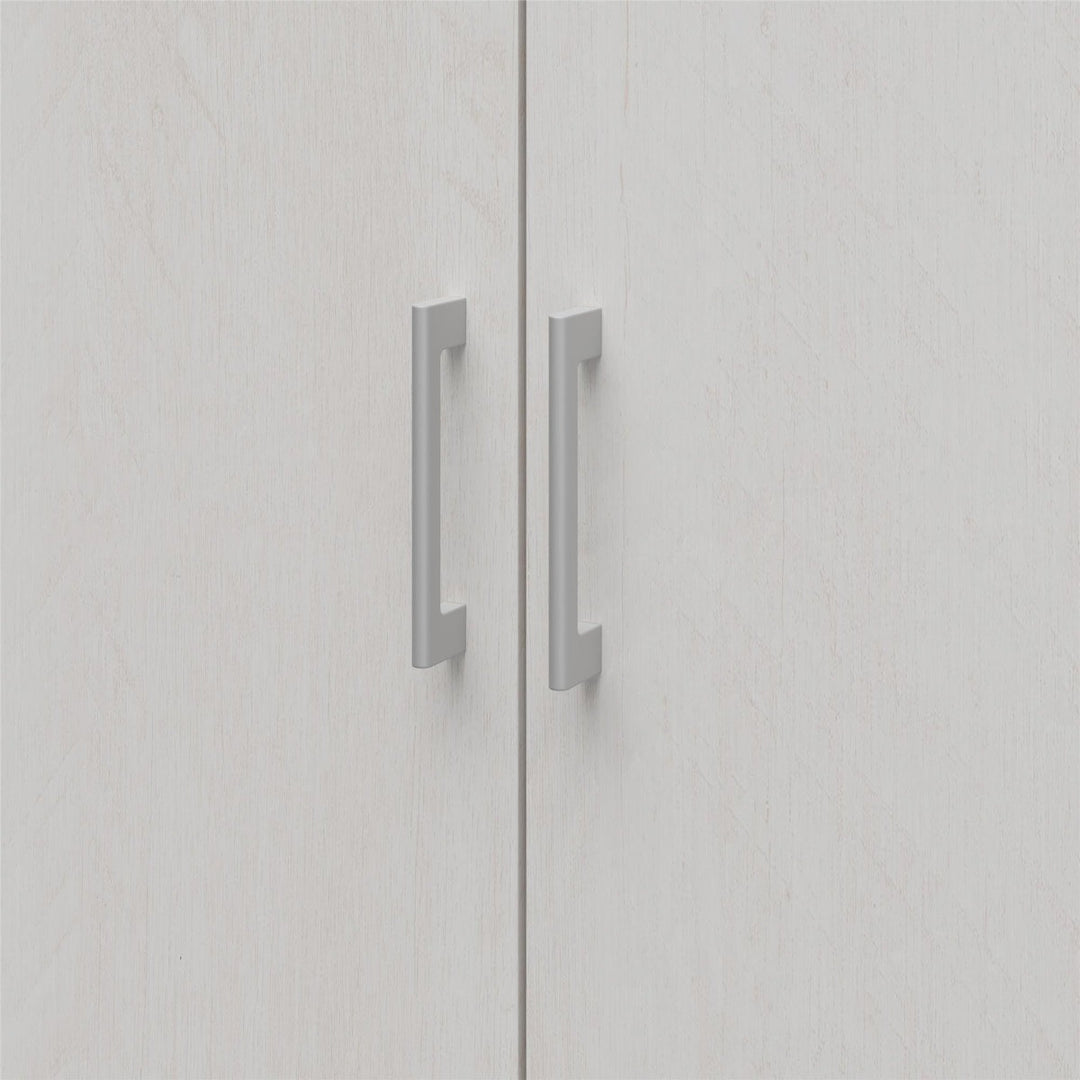 Close-up of a light grey wardrobe with metallic handles on a white background