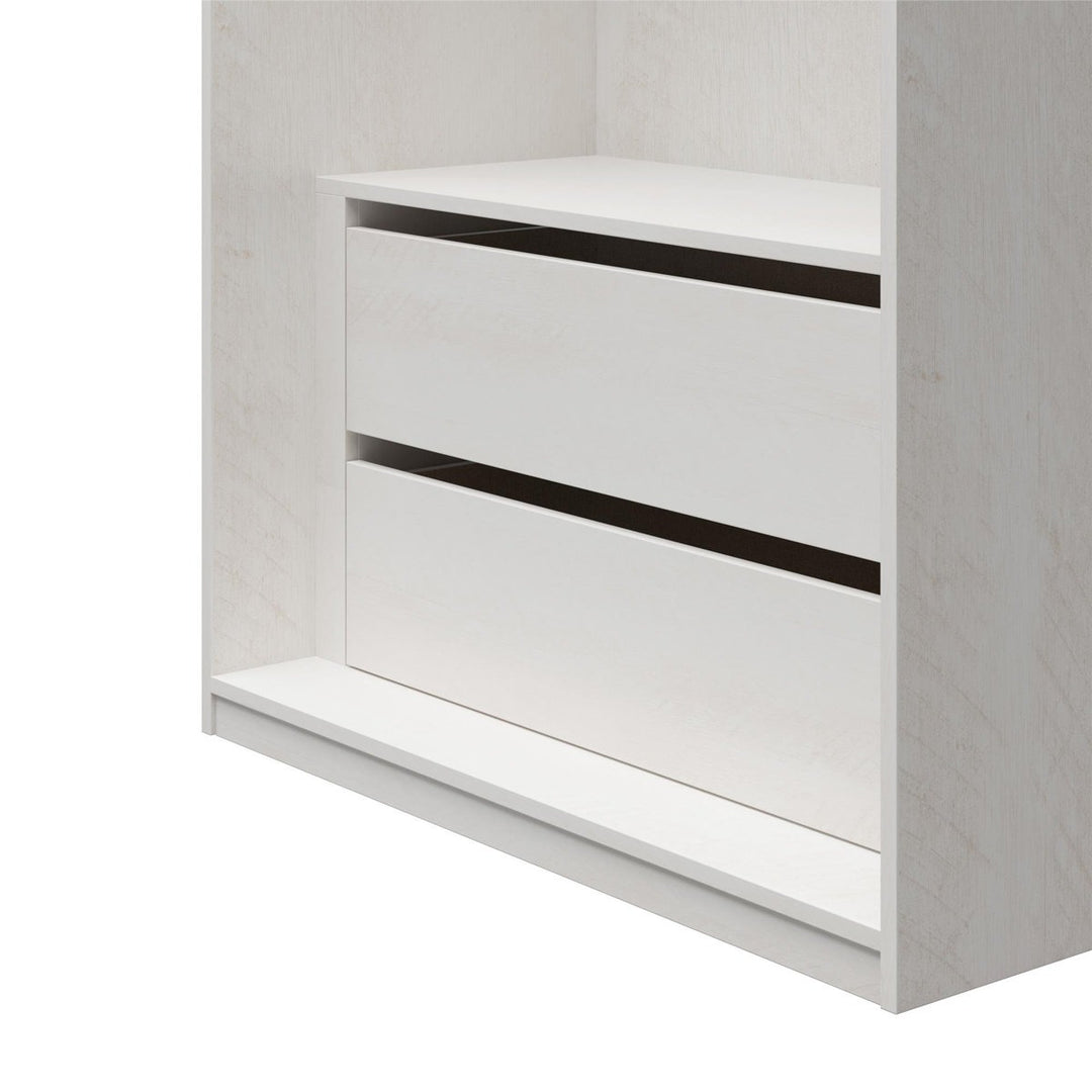 White wardrobe cabinet with a shelf and two drawers on a white background