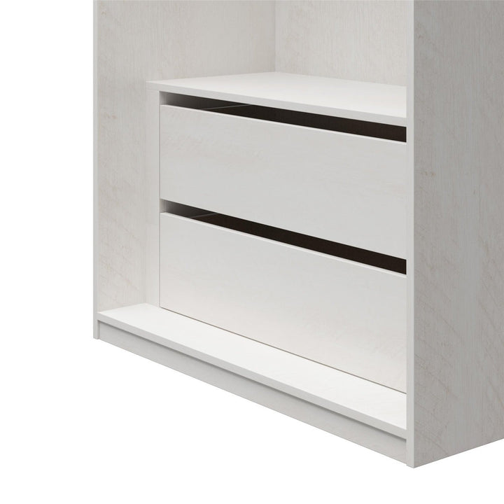 White wardrobe cabinet with a shelf and two drawers on a white background