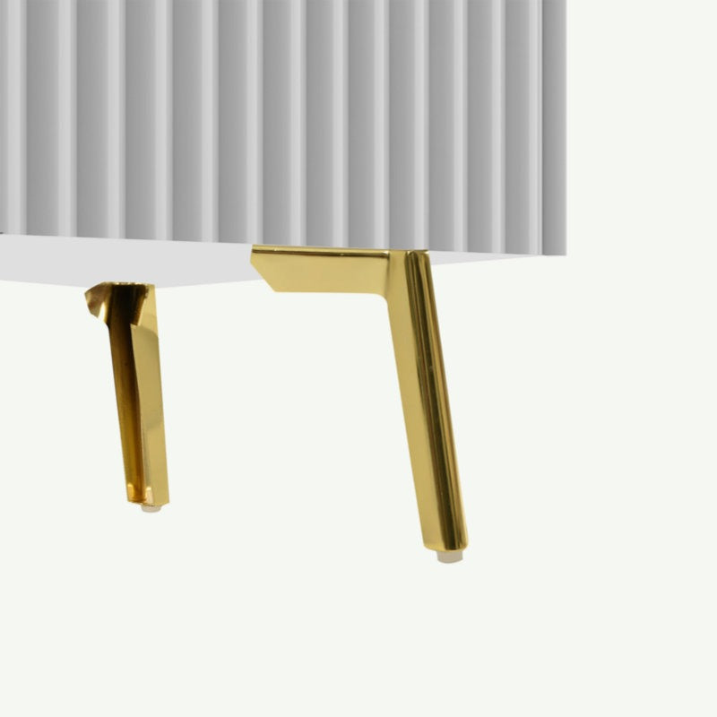 golden legs of white tv unit