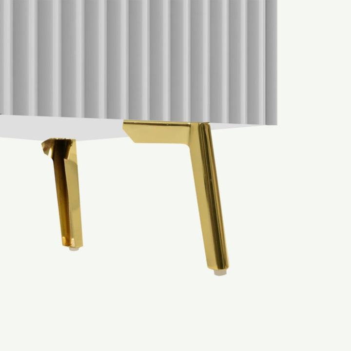 golden legs of white tv unit