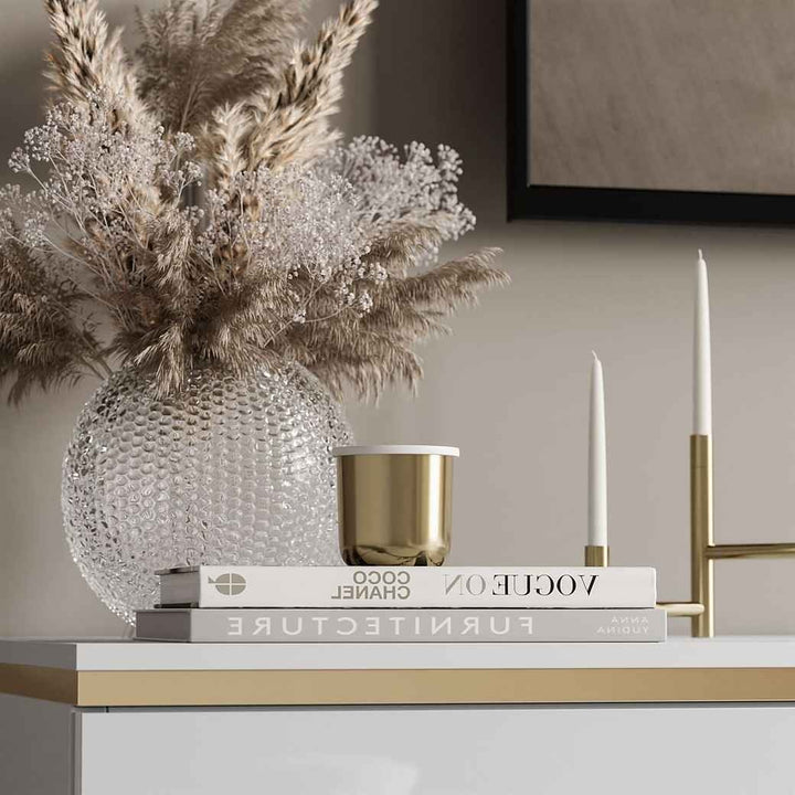 Modern white tv stand with gold strip detailing for luxurious look