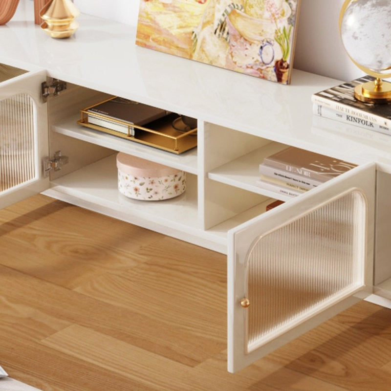 white tv unit with two fluted glass doors with golden knobs