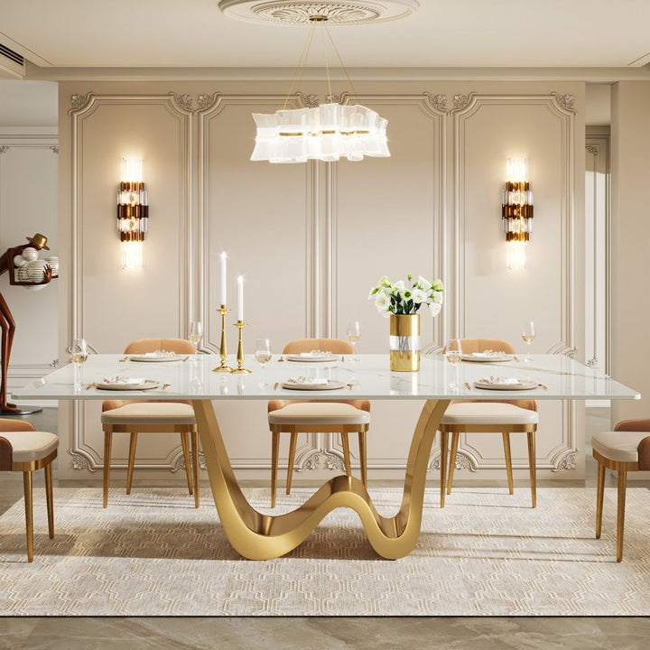 Elegant dining room with a modern W-shaped 8-seater dining table and chairs.