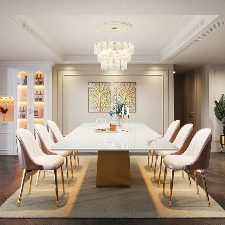 Elegant dining room with a W-shaped dining table and comfortable chairs.