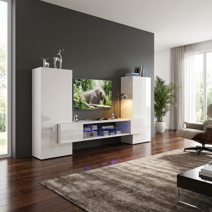 Modern living room with a white entertainment console, TV, and decorative items.