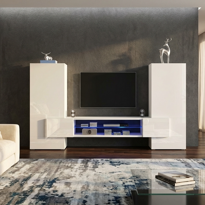 Modern living room with a white entertainment console, TV, and decor.