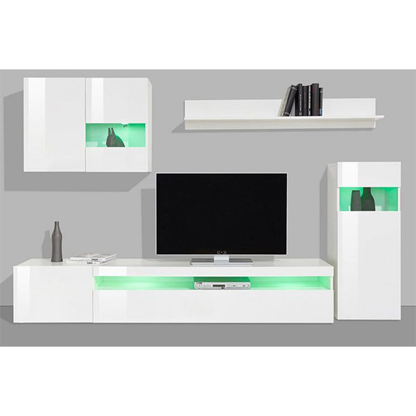 A white matte TV unit set with various shelves and cabinets, featuring a flat-screen TV, books, a bottle, and other decorative items.