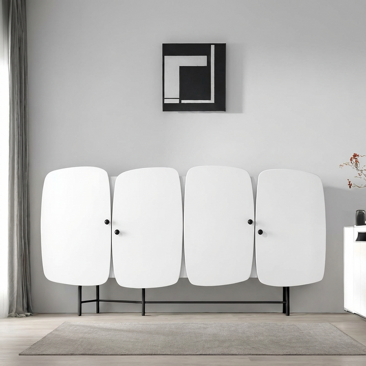 Modern room with a wall-mounted art piece and a white sideboard cabinet