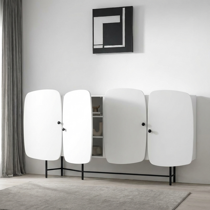 Modern white cabinet with 4 doors in a minimalistic room.